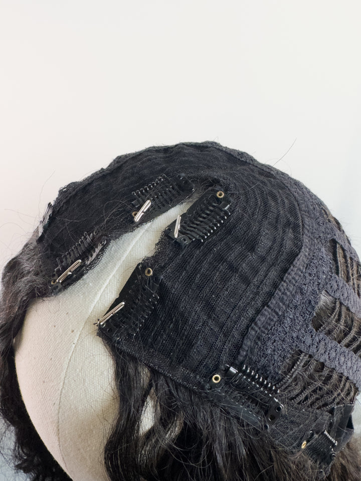 Inside detail of vpart wig cap construction at front of unit parting