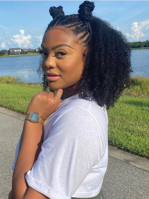 Model wearing curly clip ins for protective styling, braids with afro curly hair extensions hairstyle