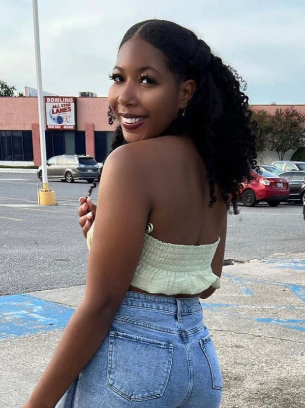 Woman wearing protective style using clip in hair extensions for type 3b/c natural textures