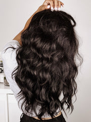 back view of loose waves on kinky straight clip-in hair extensions for Black Women by Melanj Hair